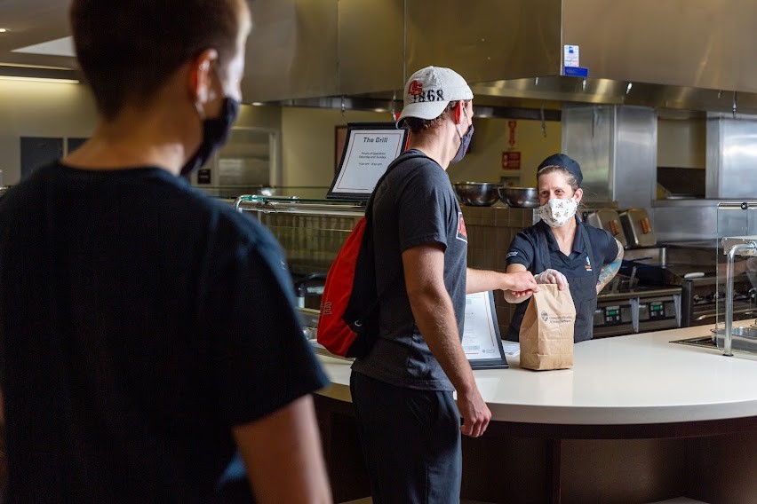 four students eating at Arnold Dining Center