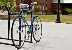 bicycle in rack outside Tebeau Hall