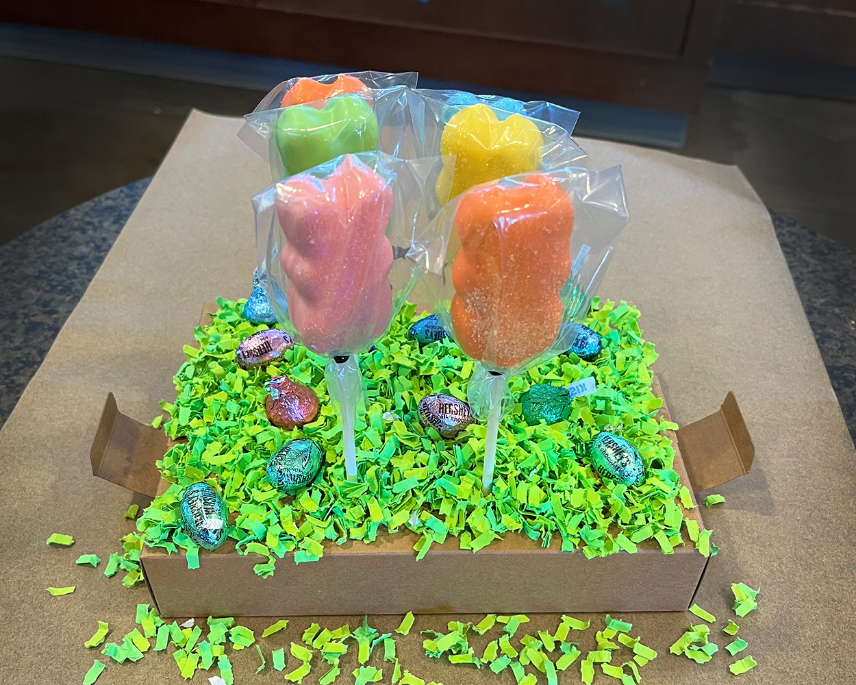 bunny shaped cake pops in a cardboard box